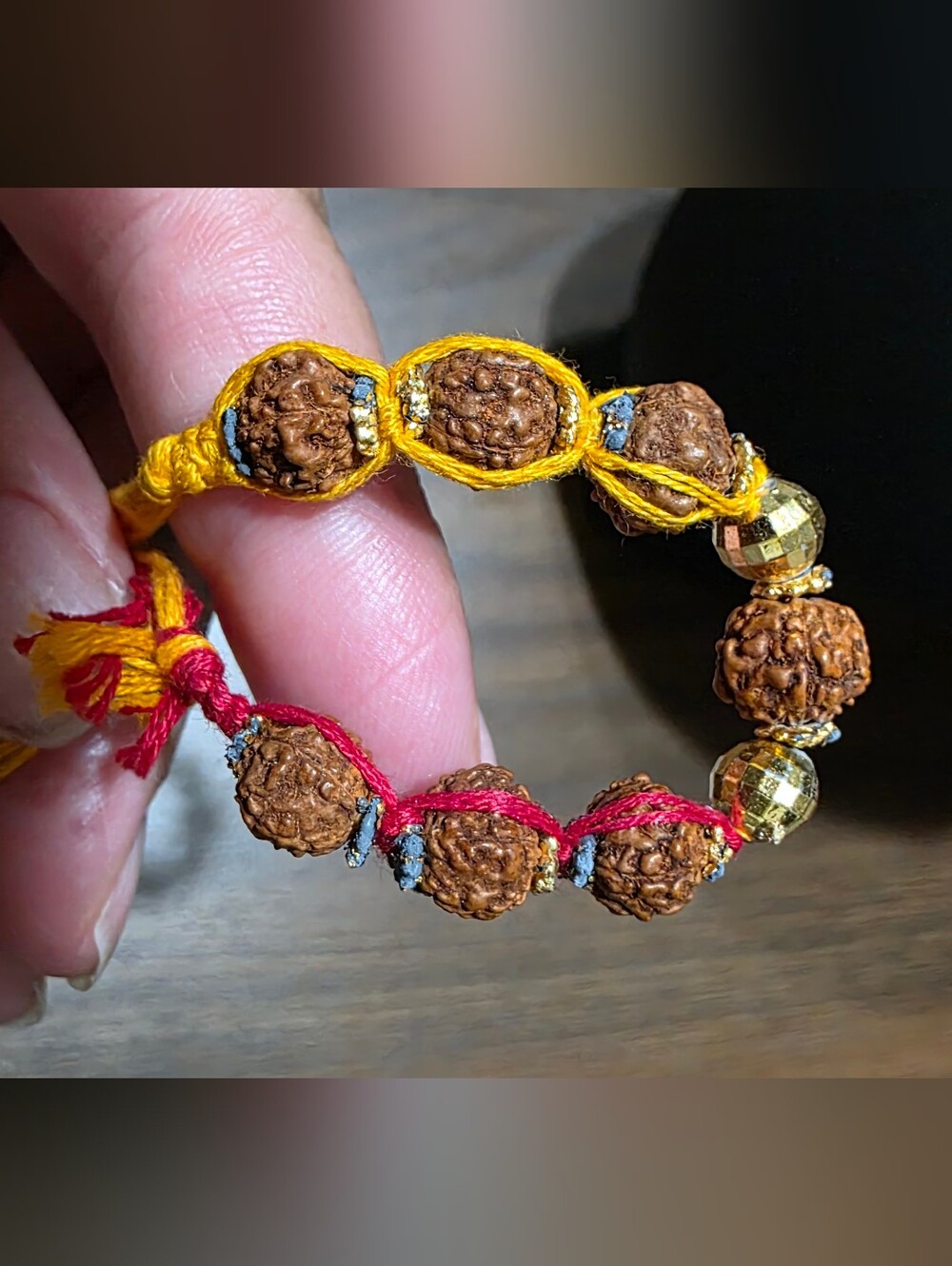 Handcrafted Rudraksha Bead Bracelet - Yellow & Red Cord